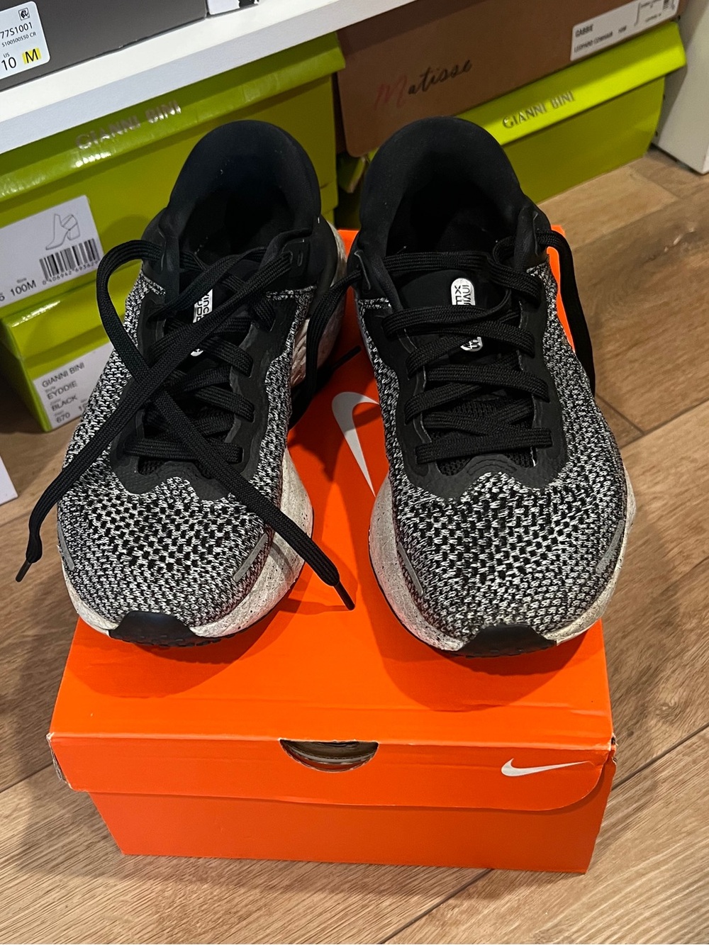 Women’s size 10 Nike Black and White Knit Sneakers.
